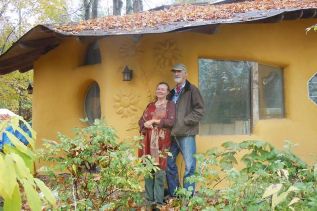 Kathryn and Ross Elliott in front of their straw bale studio in McDonalds Corners